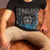 man-sitting-on-floor-wear-lion-face-fearless-text-printed-round-neck-black-t-shirt