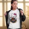 Woman wearing a white t-shirt with a cute Hello Kitty eating ramen print