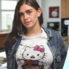 Woman wearing a white t-shirt with a cute Hello Kitty eating ramen print