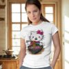 Woman wearing a white t-shirt with a cute Hello Kitty eating ramen print