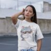 Woman wearing a White Cattitude T-Shirt with a cool cat graphic and sunglasses