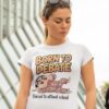 Woman wearing a white t-shirt with a cartoon character and the text "Born to Debate, Forced to attend school"
